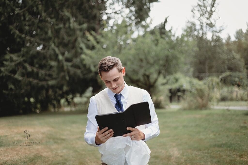 groom opening gift from bride