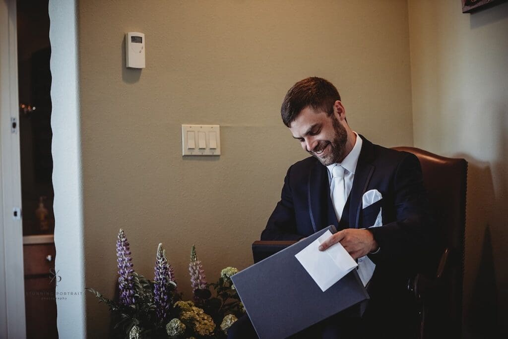 groom opening gift from bride - boudoir album